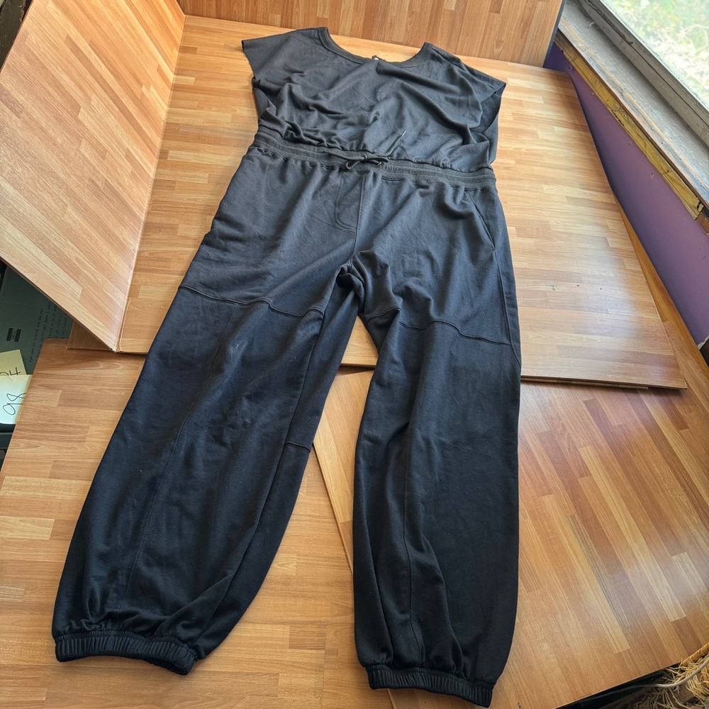 Black one piece, sleeveless jumpsuit size XL elastic ankle